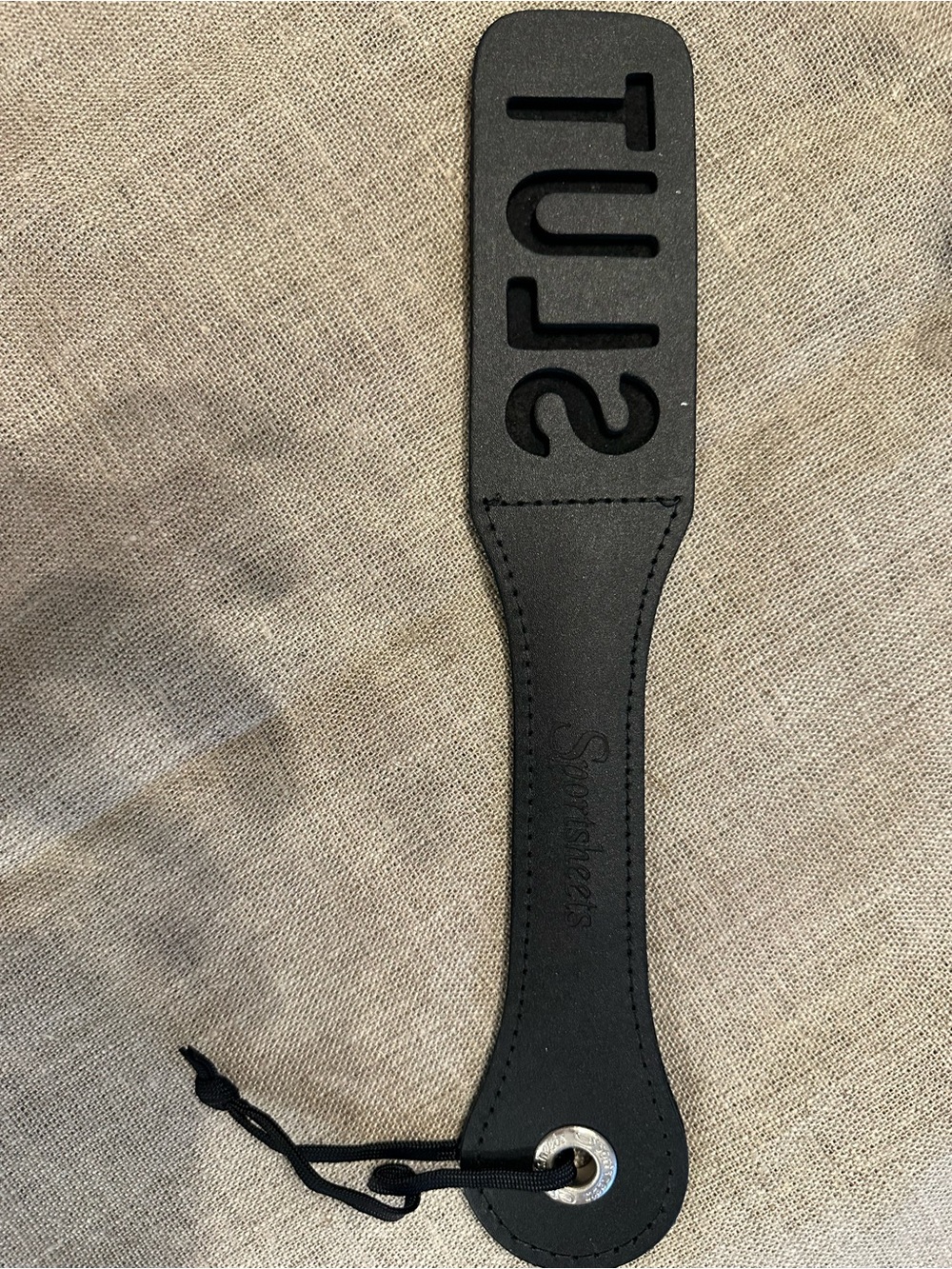 Black Leather Paddle with Embossed Lettering and Wrist Loop
